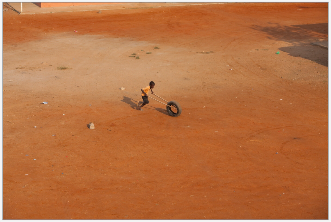 Boy With Tire, Anglola
